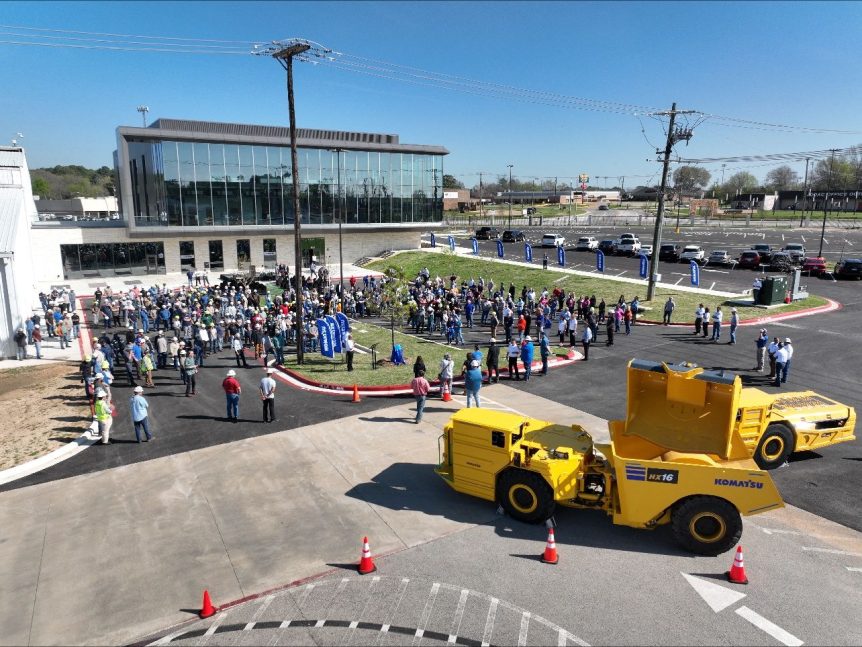 A crowd gathers at the Komatsu Building Dedication ceremony.